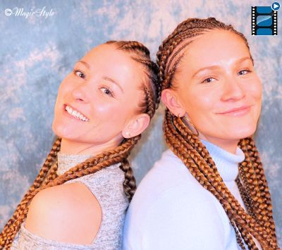 Junge Frau mit elegant hochgesteckten Cornrows